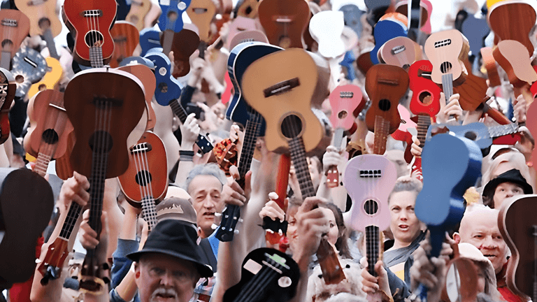 Crowd of people holding various ukuleles in celebration and unity