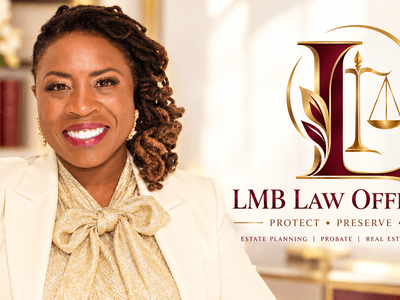 Smiling professional woman in a cream blazer posing in a law office setting